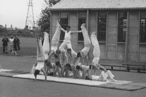 The 91 1954 Gym Club members making a human pyramid