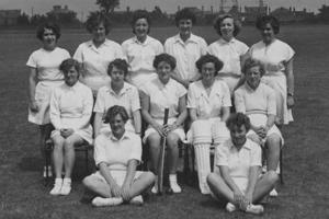 The 91 Women's cricket team wearing white uniforms in 1953